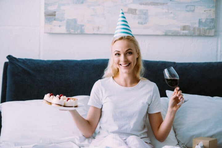 Aunt holding a cake celebrating her birthday