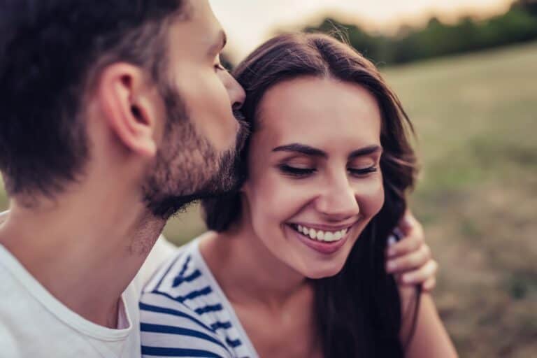Romantic couple kissing celebrating birthday
