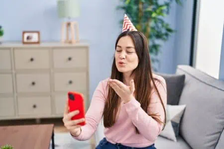 Young woman taking a selfie for her birthday