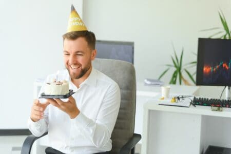 boss celebrating his birthday with a cake