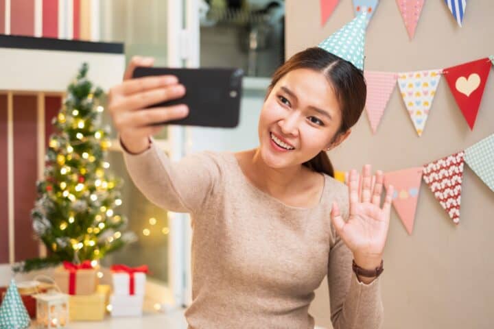 asian woman celebrating her birthday long distance